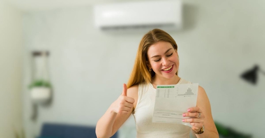 Happy woman saving money with efficient air conditioning unit