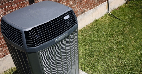 residential heat pump installed in a yard